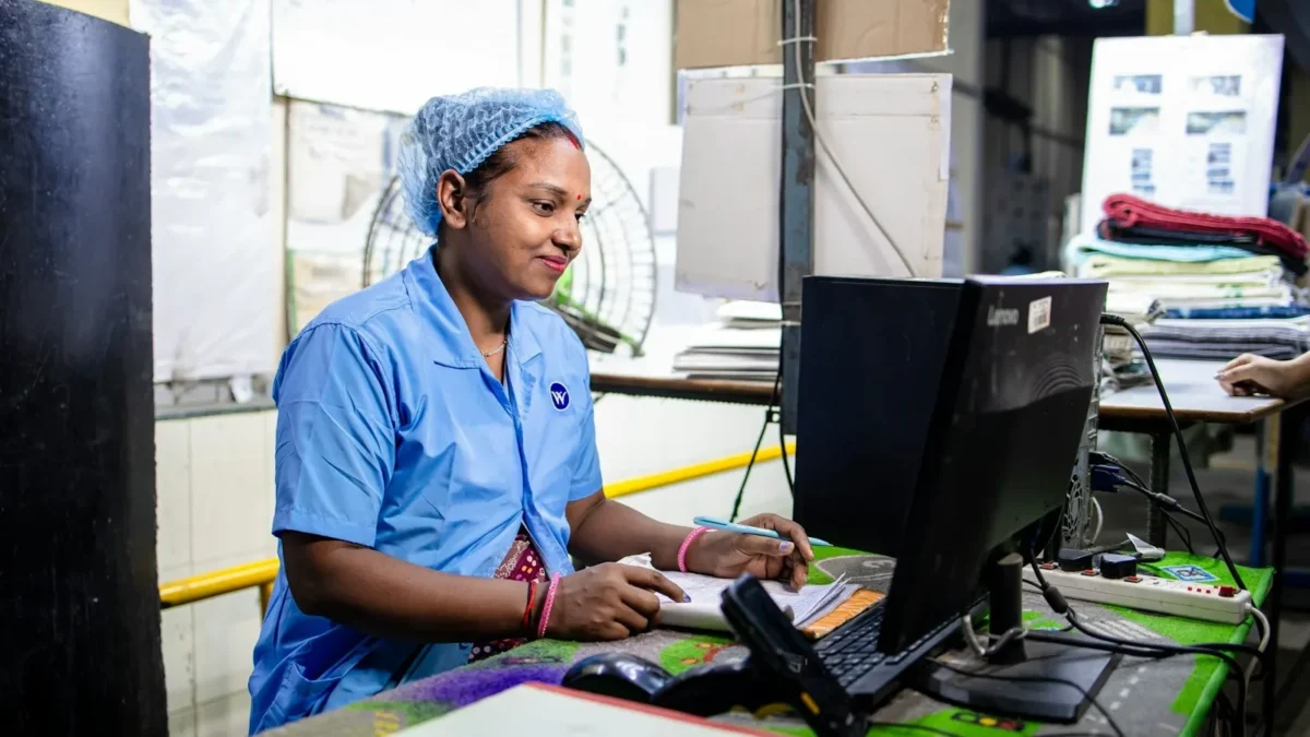 A woman is working on a computer